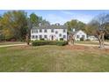 Traditional home showcasing its symmetrical design, well-kept lawn, and mature landscaping at 817 Evans Rd., Marion, SC 29571