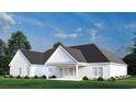 A bright white single story home with a covered porch overlooking a manicured lawn at 974 Crooked Oak Dr., Pawleys Island, SC 29585