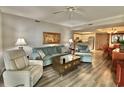 Cozy living room features comfortable seating, warm lighting, and seamless flow to the kitchen at 9994 Beach Club Dr. # 408, Myrtle Beach, SC 29572