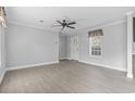 Living room with new flooring and an entry door, creating a welcoming space at 103 Off Shore Dr., Murrells Inlet, SC 29576