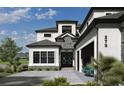Elegant home exterior boasting a unique front door, stone accents, and a spacious driveway at 1315 Ashboro Ct., Myrtle Beach, SC 29579
