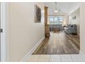Open living room with hardwood floors and plenty of natural light, creating a bright and airy space at 136 Regency Dr., Conway, SC 29526