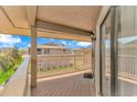 Charming covered balcony featuring wood floors and ample space for outdoor seating with views of the community at 1801 N Ocean Blvd. # A4, North Myrtle Beach, SC 29582