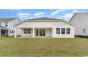 A spacious backyard featuring a covered patio and ample green space at 1804 Hardwood Ct., Conway, SC 29526
