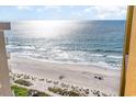 Expansive beach view showcasing the ocean's shimmer and sandy shore from above at 2600 N Ocean Blvd. # 1401, Myrtle Beach, SC 29577