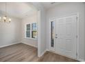 Inviting foyer with wood flooring and plenty of natural light streaming through at 3339 Little Bay Dr., Conway, SC 29526