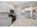 Bright kitchen features stainless steel appliances and granite countertops at 3339 Little Bay Dr., Conway, SC 29526