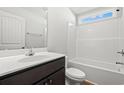 Clean bathroom features a tub shower, a wooden vanity, and a medicine cabinet mirror at 343 Barn Owl Way, Conway, SC 29527