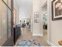 Inviting entryway features tile flooring, neutral walls, and views into the living area at 363 Cypress Springs Way, Little River, SC 29566