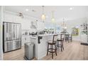 Bright and spacious kitchen with stainless steel appliances, bar stool seating, and marble countertops at 422 Harbour View Dr., Myrtle Beach, SC 29579