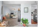 Open-concept living room with neutral paint, vaulted ceiling, and seamless flow to the kitchen at 466 Wampee St. Nw, Calabash, NC 28467