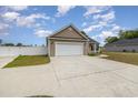 Spacious garage with an expansive driveway and a well-maintained exterior at 6392 Highway 378, Conway, SC 29527