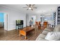 Spacious living room with hardwood floors, ceiling fan, and cozy seating area at 679 Riverwalk Dr. # 201, Myrtle Beach, SC 29579