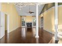 Bright living room boasting a fireplace, hardwood floors, and vaulted ceiling with lots of natural light at 808 East Coast Ln., North Myrtle Beach, SC 29582