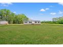 A well-kept home with a sprawling lawn and a detached building at 820 S Midway Hwy., Johnsonville, SC 29555