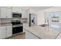Modern kitchen featuring stainless steel appliances, granite countertops and ample cabinet space at 875 Owls Nest Dr., Conway, SC 29527