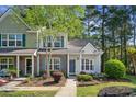 Charming townhome with brick accents, blue shutters, and a well-maintained front yard at 1064 Penny Ln. # 1064, Myrtle Beach, SC 29577