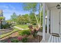 Well-maintained front yard with beautiful landscaping, inviting walkway, and serene atmosphere at 1064 Penny Ln. # 1064, Myrtle Beach, SC 29577