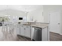 Bright and open kitchen featuring granite countertops, stainless steel appliances, and ample cabinet space at 1239 Pyxie Moss Dr., Little River, SC 29566