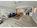 Inviting living room flows into kitchen and dining areas, showcasing spacious living at 19 Pistachio Loop # G, Murrells Inlet, SC 29576