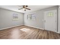 Bright living room featuring hardwood floors and a ceiling fan at 2939 King St., Loris, SC 29569