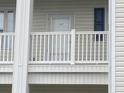Second story condo balcony with white railing at 901-9 West Port Dr. # 907, North Myrtle Beach, SC 29582