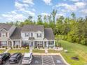 An aerial view of townhomes with ample parking and lush green surroundings in a desirable community at 1105 Dinger Ct. # 1105, Myrtle Beach, SC 29588
