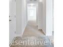 Bright hallway with tile and carpet flooring that connects different areas of the home at 1106 Cherrystone Loop, Conway, SC 29526
