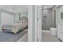 Serene main bedroom featuring an ensuite bathroom with a modern glass-enclosed shower at 112 Spartina Ct. # 26, Pawleys Island, SC 29585