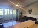 Comfortable living room featuring a sliding glass door and cozy seating area at 1450 Blue Tree Ct. # I, Myrtle Beach, SC 29588