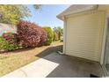 Backyard patio area with landscaping and lawn at 1512 Hallborough Dr., Surfside Beach, SC 29575