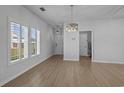 Bright living area with ample natural light, contemporary light fixtures, and durable flooring, perfect for relaxation at 181 Saddle St, Conway, SC 29527
