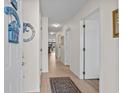 Bright hallway with neutral walls, tiled floors, and decorative wall hangings for a welcoming entrance at 1880 Auburn Ln. # 27 A, Surfside Beach, SC 29575