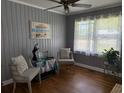 Cozy bedroom featuring neutral tones, soft textures, and natural light from the large window at 2005 Loblolly St., Georgetown, SC 29440