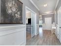 Elegant foyer boasts stylish decor, hardwood flooring, and decorative wall panels at 2013 Santa Maria St., Myrtle Beach, SC 29579