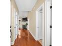 Inviting hallway with hardwood floors and multiple doorways leading to various rooms in the home at 2213 Gazebo Ct., North Myrtle Beach, SC 29582
