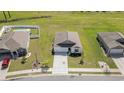An overhead shot displays the property with its landscaped yard, driveway, and proximity to neighboring homes at 3019 Woodbury Ct., Conway, SC 29527