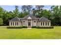 Inviting one-story brick home with a well-kept lawn and manicured hedges providing great curb appeal at 4100 Hagwood Circle, Conway, SC 29526