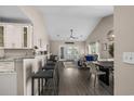 Open concept living room with a vaulted ceiling, modern furnishings, and lots of natural light at 411 Mahogany Dr. # 202, Murrells Inlet, SC 29576