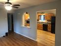 Inviting living room with wood floors offering an archway view into the kitchen at 4204 Peachtree Ln., Myrtle Beach, SC 29588