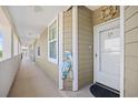 Charming walkway leading to a unit with nautical decor, including a helm and pelican art at 4518 N Planatation Harbour Dr. # G-17, Little River, SC 29566