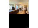 Open living and dining room area featuring wood floors and natural light at 4669 Wild Iris Dr. # 22-2O2, Myrtle Beach, SC 29577