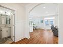 Bright hallway with hardwood floors, an archway leading to the main living space, and a half bath on the left at 5203 N Ocean Blvd. N, North Myrtle Beach, SC 29582