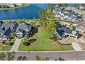Aerial view of the vacant lot for sale bordered in red near neighborhood lake and established homes at 573 Starlit Way, Myrtle Beach, SC 29579