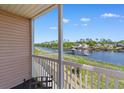 A view from the balcony shows a waterfront community, tranquil waters, and a blue sky backdrop at 608 Waterway Village Blvd. # 27-F, Myrtle Beach, SC 29579