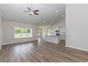 Inviting living room and kitchen combo featuring vaulted ceilings and plenty of natural light at 625 Woodside Dr., Conway, SC 29526