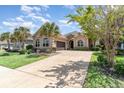 A ranch home featuring desert landscaping and an extra long driveway leading up to the home at 7041 Turtle Cove Dr., Myrtle Beach, SC 29579