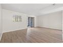 Light bedroom featuring wood-look flooring and a sliding glass door at 775 Plantation Dr. # 87, Little River, SC 29566