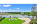 Waterfront community featuring a lakeside pergola, beach, picnic tables, and scenic water views at 809 Covelo Ln., Myrtle Beach, SC 29579
