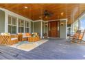 Inviting covered porch with comfortable seating, rocking chairs, and a warm, welcoming ambiance at 9 Gasparilla Circle, Murrells Inlet, SC 29576